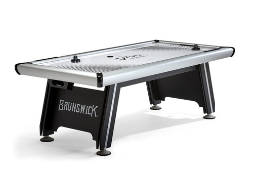 ¾ angled hero image of the Brunswick V-Force 2.0 Air Hockey Table in black and white finish, featuring a scuff-proof “ice” playfield, aluminum rail corners, and bold Brunswick logo on the pedestal base—available exclusively at SawyerTwain.com.