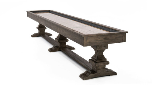 A stunning ¾ view of the Beaumont Shuffleboard Table in Silvered Ash, highlighting the smooth maple butcher block playfield, sleek pedestal legs, and clean, modern lines of the table’s design. Perfect for adding a stylish focal point to any game room.