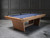 Front view of the Doc & Holliday Kaci Slate Pool Table with dining top in place, finished in glazed maple.