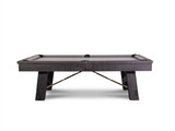 Side view of the Isaac Slate Pool Table in Distressed Black & Gold, capturing the full length of the table. This angle highlights the sleek, rustic distressed black finish, the gold turnbuckles, and the wooden top rails, giving a full appreciation of the table's robust design and premium materials.