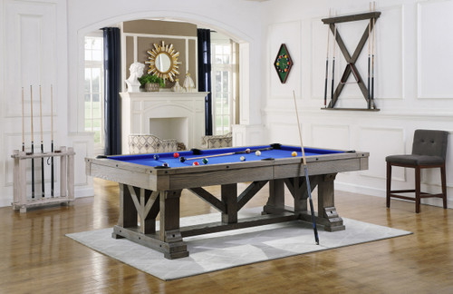 Playcraft Cross Creek Slate Pool Table in pewter finish shown in a rustic-modern game room. Timber frame design and black hammered metal accents anchor the space.