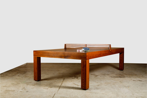 Buckhead Table Tennis by Venture Shuffleboard, exclusive to Sawyer Twain USA, is showcased in a refined, furniture-style design built with solid wood. This luxury table, made in the USA, features a premium composite playing surface and robust steel frame. Its sleek lines and architecturally inspired design offer optimal ball bounce and control while serving as a striking centerpiece for upscale interiors.