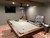 Styled within a finished home game room, this wall rack in Distressed Brown is the perfect companion to the Beaumont Slate Pool Table. The rich wood tone and clean design blend effortlessly into the space, offering smart storage without sacrificing style. As a Sawyer Twain exclusive, it ties the full setup together—adding functional elegance to your game night sanctuary.