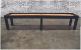 A sleek side profile of the Buckhead Shuffleboard Table showcases its minimalist Parsons-style legs and premium hardwood frame. Hand-finished with Venture's exclusive stains, this shuffleboard table is a statement piece designed to complement modern interiors while delivering flawless gameplay