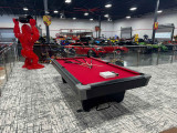 Step into opulence: Sawyer Twain presents the Brunswick Black Wolf Pro Pool Table in a Miami Beach luxury garage filled with premium cars and trucks.