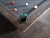 Genuine 1-inch slate playing surface of the Kai Pool Table in Grayson Grey, featuring durable solid wood rails and K66 cushions for accurate ball rebound.